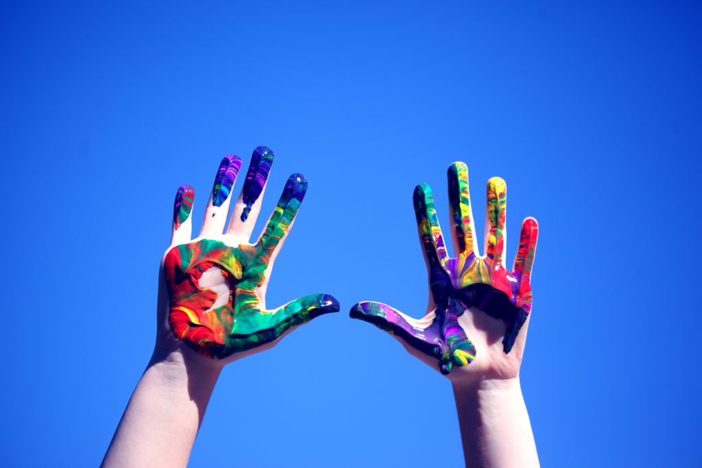 Hands painted with Rainbow or Pride Colors